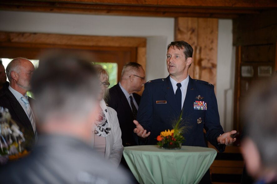 Col. Harry Benham, U.S. Air Forces in Europe Operations and Plans chief and F-15 Strike Eagle pilot, speaks to members of the Dietingen community as part of a memorial ceremony for 2nd Lt. Priesley Cooper Jr. Sept. 25, 2015, at Dietingen, Germany. Benham spoke about the feelings of entering combat and thanked the community members of Dietingen for taking care of the pilot and providing closure to the family. (U.S. Air Force photo/Staff Sgt. Armando A. Schwier-Morales)
