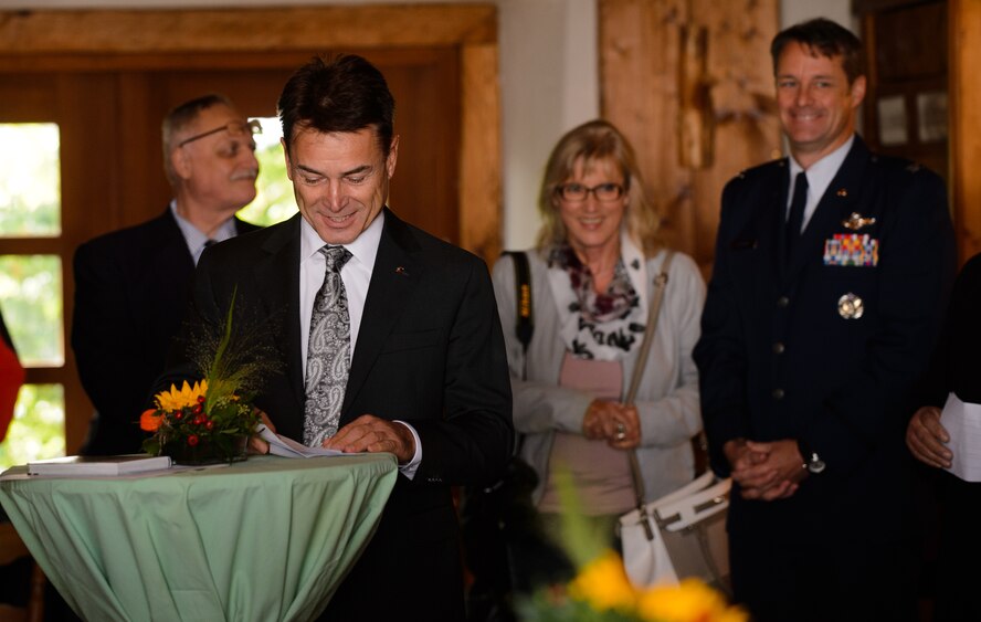 Frank Sholz, Dietingen mayor, jokes about his lack of English during a ceremony honoring the late 2nd Lt. Priesley Cooper Jr. Sept. 25, 2015, at Dietingen, Germany. Swanson spoke about Dietingen’s journey to find and locate the pilot’s crash site and reunite Cooper’s flight cap with his relatives. (U.S. Air Force photo/Staff Sgt. Armando A. Schwier-Morales)