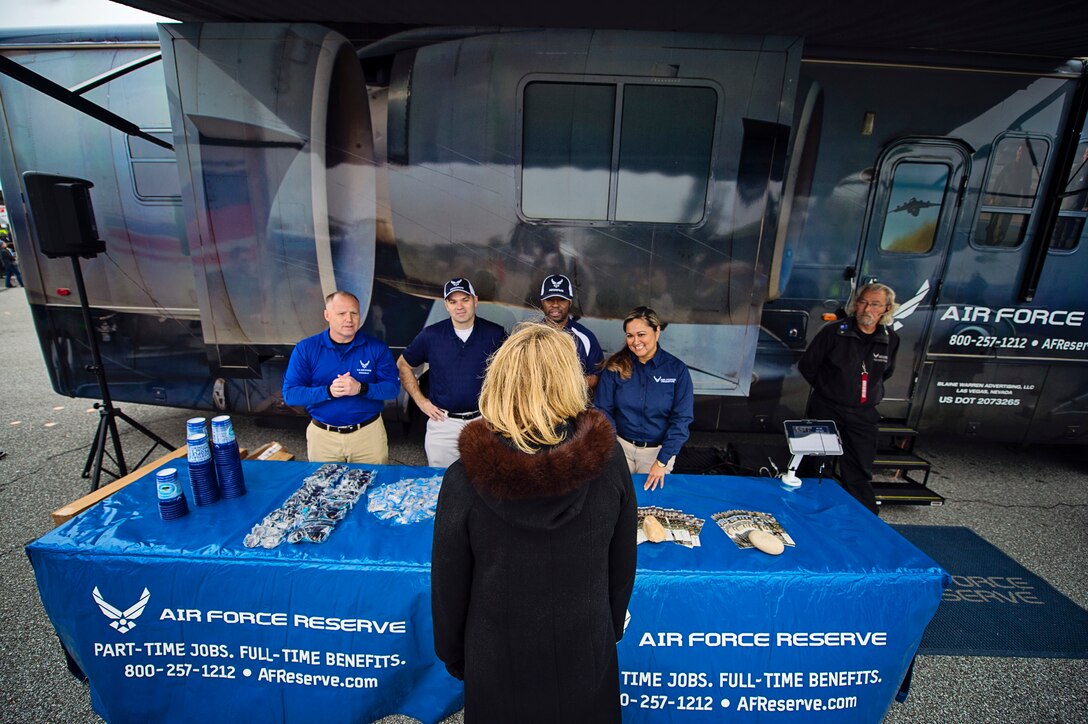 Air Force Reserve recruiters from the 512th Airlift Wing, Dover Air Force Base, Del., meet Secretary of the Air Force Deborah Lee James while they manned a booth and an AF Reserve recreational vehicle inside the Military Village Expo at the AAA 400 NASCAR race at the Dover International Speedway, Dover, Del., Oct. 4. James was an honored guest at the track and administered the oath of enlistment to over 22 recruits entering the Armed Services, along with meeting members of ‪Team Dover‬. (U.S. Air Force photo/Capt. Bernie Kale)
