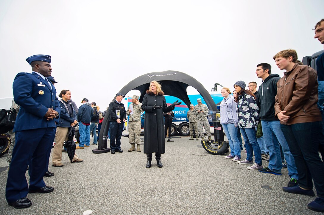 Secretary of the Air Force Deborah Lee James turns to thank the parents of future Air Force airmen inside the Military Village Expo at the AAA 400 NASCAR race at the Dover International Speedway, Dover, Del., Oct. 4. James was an honored guest at the track and administered the oath of enlistment to over 22 recruits entering the Armed Services, along with meeting members of ‪Team Dover‬. (U.S. Air Force photo/Capt. Bernie Kale)