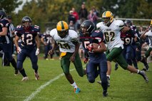 A Bitburg Middle High School Barons player sprints for the end zone against the SHAPE Spartans during the Bitburg Middle High School homecoming football game at Bitburg Annex, Germany, Oct. 3, 2015. The team’s next game is against the International School of Brussels Raiders in Brussels Oct. 10. (U.S. Air Force photo by Staff Sgt. Christopher Ruano/Released)