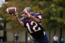 A Bitburg Middle High School Barons receiver attempts to catch a pass during the homecoming football game at Bitburg Annex, Germany, Oct. 3, 2015. The Barons defeated the SHAPE Spartans 32-7. (U.S. Air Force photo by Staff Sgt. Christopher Ruano/Released)