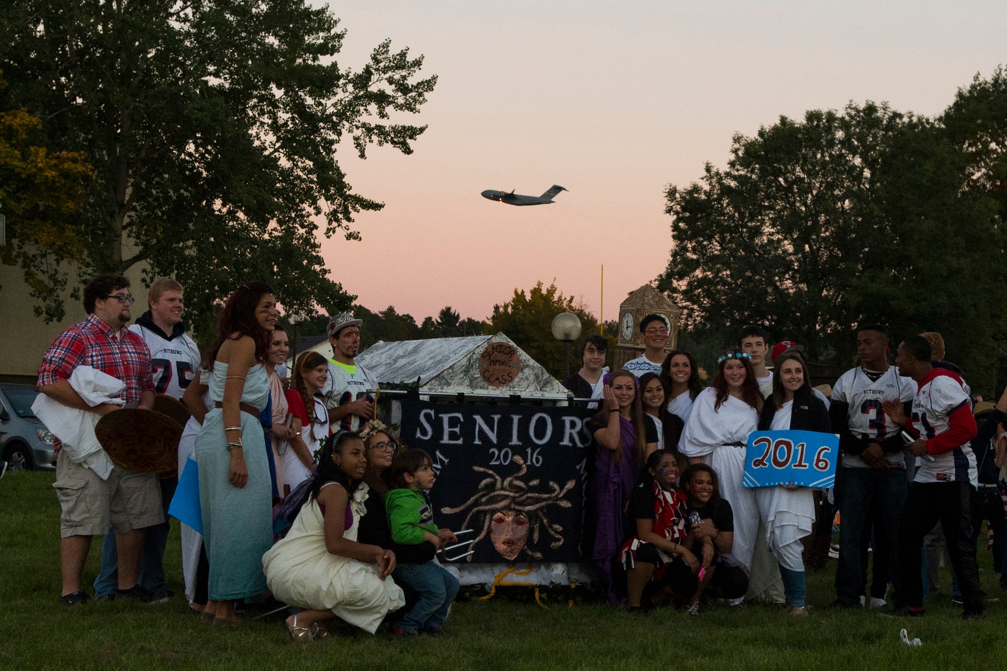 Senior students from Bitburg Middle High School gather for a group photo after a Homecoming parade at Spangdahlem Air Base, Germany, Oct. 2, 2015. The seniors wore togas in order to depict their Greek theme for the night. (U.S. Air Force photo by Airman 1st Class Luke Kitterman/Released)
