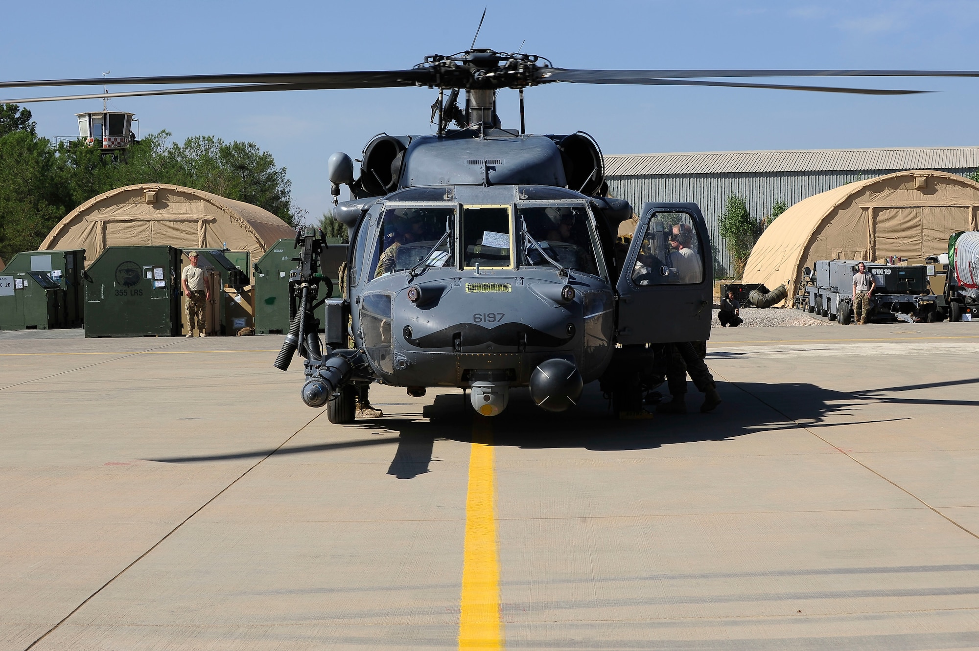 An aircrew prepares to unload a HH-60G Pave Hawk at Diyarbakir Air Base, Turkey Oct. 1, 2015. The aircraft is deployed to Diyarbakir AB to enhance Coalition capabilities and personnel recovery operations in Syria and Iraq. (U.S. Air Force photo by Airman 1st Class Cory Bush)