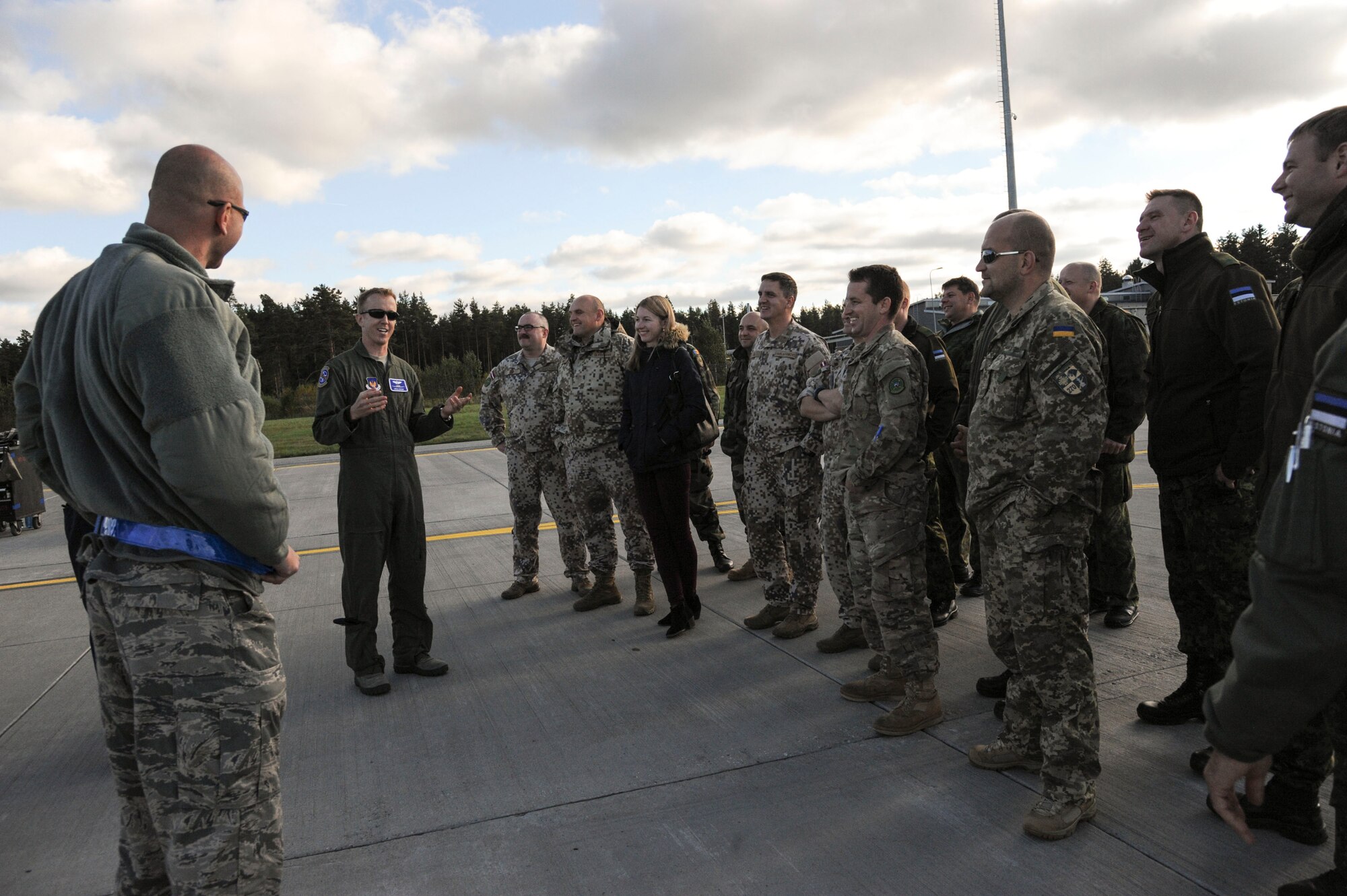 Members of the Baltic Defense College listen to U.S. Air Force Maj. Dan Edgar, 74th Expeditionary Fighter Squadron director of operations, during a tour at Amari Air Base, Estonia, Sept 30, 2015. During their visit, Edgar and maintainers gave the group a 30 minute capabilities briefing of an A-10 Thunderbolt II attack aircraft.  (U.S. Air Force photo by Andrea Jenkins/Released)