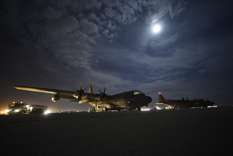 Two HC-130J Combat King II sit on the flight line in preparation for cargo unload at Diyarbakir Air Base, Turkey, Sept. 28, 2015. The aircraft is deployed to Diyarbakir AB in an effort to enhance Coalition capabilities and support personnel recovery operations in Syria and Iraq. (U.S. Air Force photo by Airman 1st Class Cory W. Bush/Released)