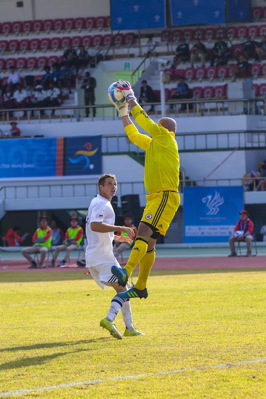 U.S. men's soccer team player Joshua Blodgett, right, stops the ball from entering the net during a game against the Qatar men's soccer team at the 6th CISM Military World Games in Mungyeong, South Korea, Oct. 4, 2015. U.S. Marine Corps photo by Sgt. Ashley Cano