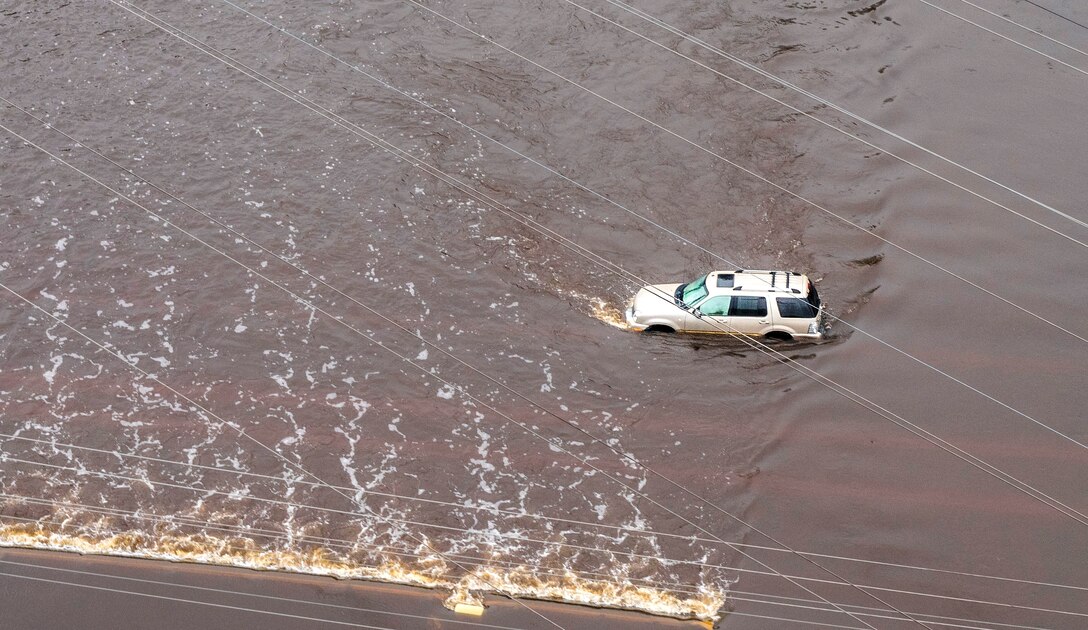 An aerial view taken from a Coast Guard helicopter showing stranded vehicle in flooded waters caused by Hurricane Joaquin in areas surrounding Charleston, S.C., Oct. 5, 2015. U.S. Coast Guard photo by Petty Officer 1st Class Stephen Lehmann