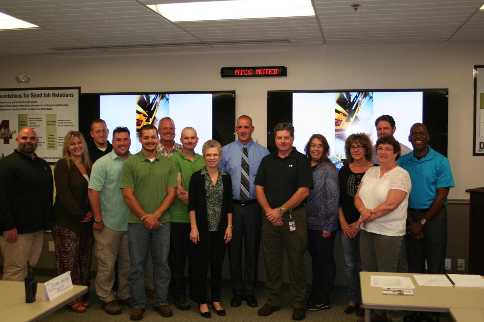 Twila Gonzales, Senior Executive Service, deputy commander of DLA Distribution, stands with the first graduates of the Foundations of High Performing Leadership pilot at DLA Distribution Tobyhanna, Pa.