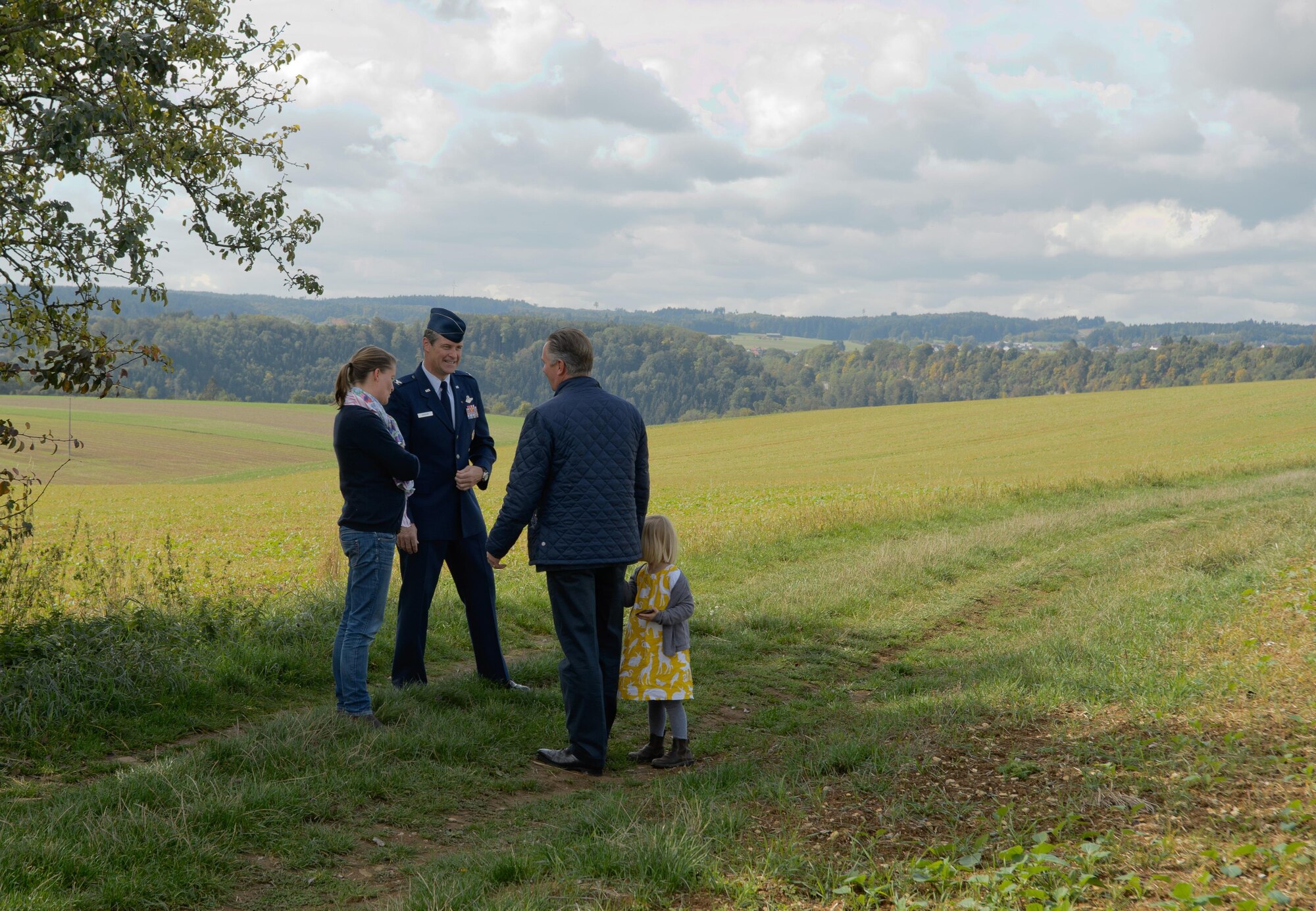 Col. Harry Benham, U.S. Air Forces in Europe-Air Forces Africa operations and plans chief, speaks with the owners of the land Sept. 25, 2015, in Dietingen, Germany, where 2nd Lt. Priesley Cooper Jr.’s P-51 D Mustang was shot down. Cooper was killed in action during a strafing run in World War II. The town of Dietingen buried him and 70 years later held a ceremony to honor him. (U.S. Air Force photo/Staff Sgt. Armando A. Schwier-Morales) 