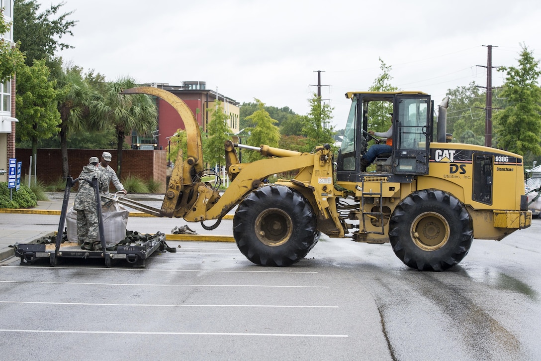 South Carolina Army National Guard soldiers deliver sandbags to the Columbia Riverfront Canal in Columbia, S.C., Oct. 5, 2015. South Carolina National Guard photo by Air Force Tech. Sgt. Jorge Intriago