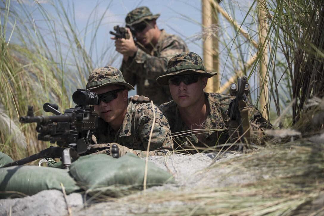 U.S. Marines sight in during platoon movement at Crow Valley, Philippines, during Amphibious Landing Exercise 2015, Oct. 2, 2015. The Marines are assigned to Echo Company, 2nd Battalion, 5th Marine Regiment. U.S. Marine Corps photo by Lance Cpl. Juan Bustos