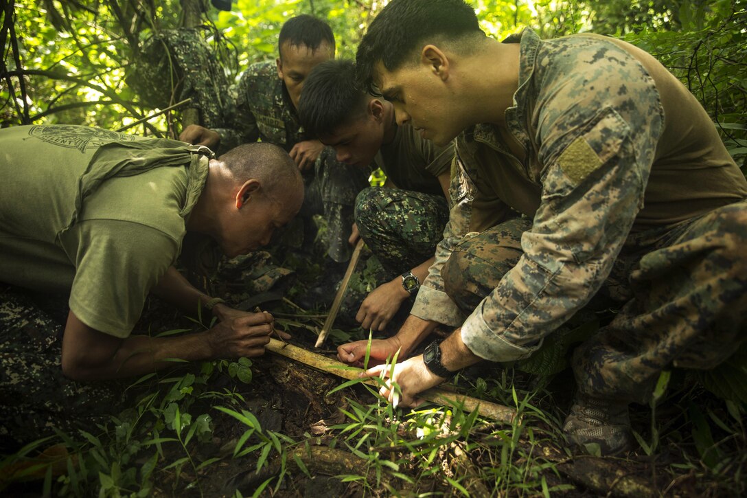 U.S. and Philippine Marines start a fire using bamboo during jungle survival training as part of Amphibious Landing Exercise 2015 in Ternate, Philippines, Sept. 29, 2016. The Marines learned basic jungle survival skills, such as building a fire, finding sources of fresh water and catching food. The training exercise aims to strengthen the interoperability and working relationships across a wide range of military operations. U.S. Marine Corps photo by Cpl. Joey S. Holeman Jr.