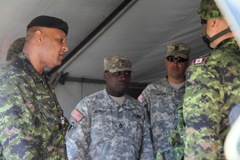 Sgt. 1st Class Oniel Murray of the Fort Lonard Wood, Mo., 1st Brigade Engineers and Sgt. 1st Class John Reyes of the Knoxville, Tenn., 1-100th Engineer Battalion help Canadian Forces Warrant Floyd Carter conduct troop inspections at the Canadian Forces School of Military Engineering (CFSME) at Canadian Forces Base Gagetown in New Brunswick, Canada, as part of an instructor exchange initiative between the U.S. and the CFSME, spearheaded by 1st Brigade Engineers out of Fort Leonard Wood, Mo.