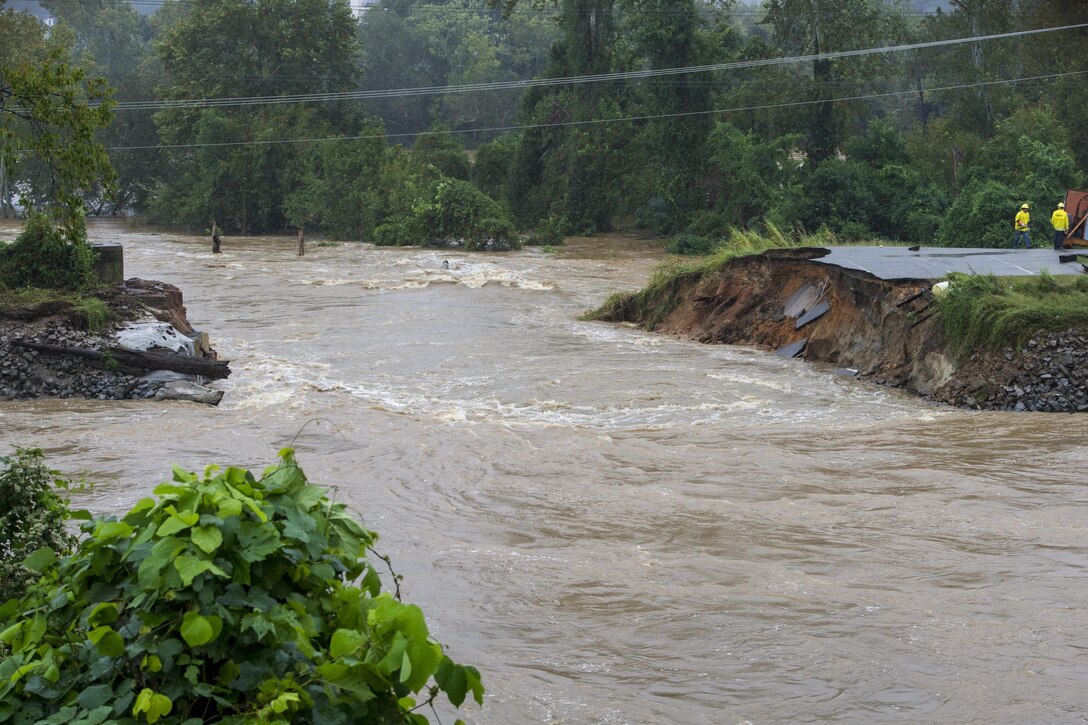 Statewide flooding following heavy rainfall generated by Hurricane Joaquin caused a levee breach at the Columbia Riverfront Canal in Columbia, S.C., shown here Oct. 5, 2015. South Carolina National Guardsmen delivered large sandbags to help seal the breach. South Carolina Air National Guard photo by Tech. Sgt. Jorge Intriago