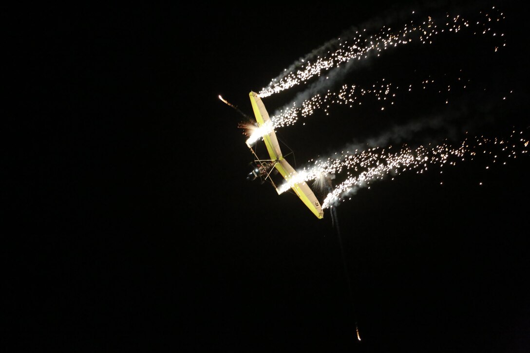 Dan Buchanan pilots an illuminated hang glider during his performance at the 2015 MCAS Miramar Air Show aboard Marine Corps Air Station Miramar, Calif., Oct. 3. Buchanan has accrued more than 2,400 hours of flight time in hang gliders. (U.S. Marine Corps photo by Cpl. Alissa P. Schuning/Released)
