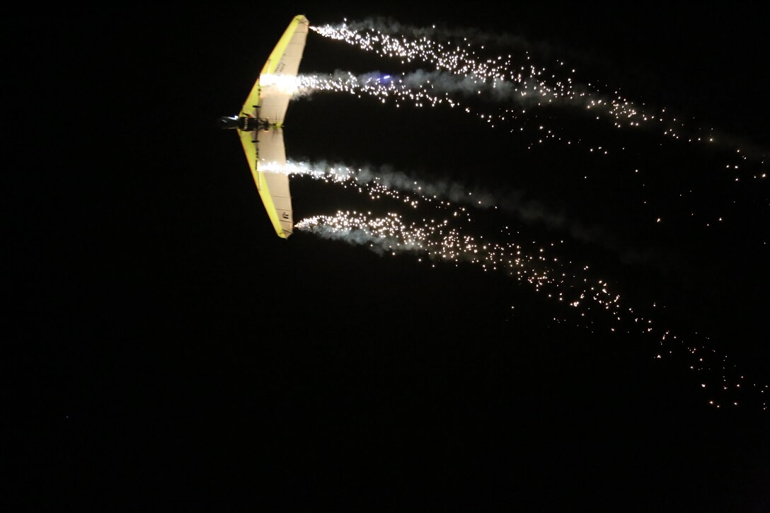 Dan Buchanan pilots an illuminated hang glider during his performance at the 2015 MCAS Miramar Air Show aboard Marine Corps Air Station Miramar, Calif., Oct. 3. Buchanan has accrued more than 2,400 hours of flight time in hang gliders. (U.S. Marine Corps photo by Cpl. Alissa P. Schuning/Released)