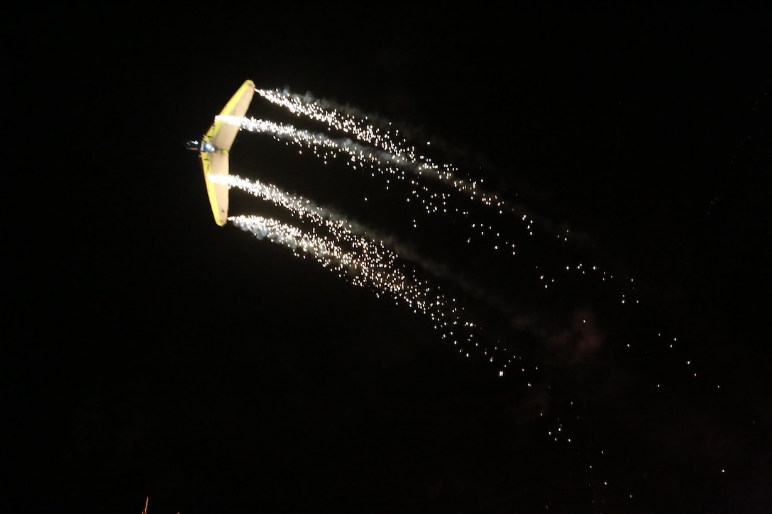 Dan Buchanan pilots an illuminated hang glider during his performance at the 2015 MCAS Miramar Air Show aboard Marine Corps Air Station Miramar, Calif., Oct. 3. Buchanan has accrued more than 2,400 hours of flight time in hang gliders. (U.S. Marine Corps photo by Cpl. Alissa P. Schuning/Released)
