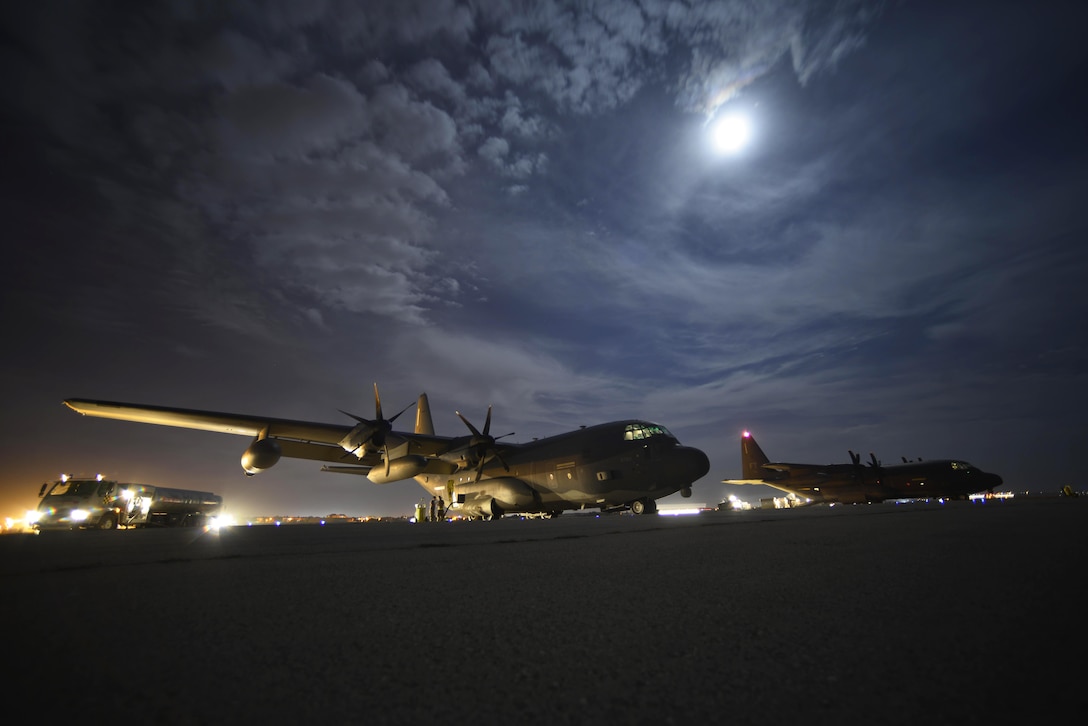 Two HC-130J Combat King II aircraft sit on the flightline awaiting cargo unloading on Diyarbakir Air Base in Turkey, Sept. 28, 2015. The aircraft are deployed to Diyarbakir to enhance coalition capabilities and support personnel recovery operations in Syria and Iraq. U.S. Air Force photo by Airman 1st Class Cory W. Bush