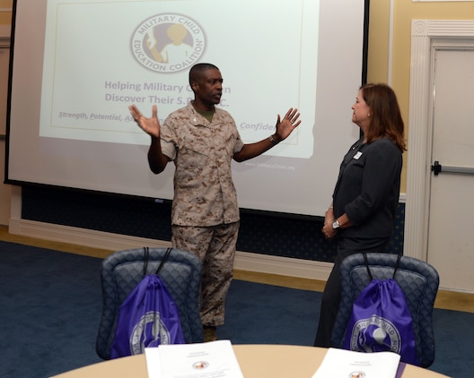 Col. James C. Carroll III, commanding officer, Marine Corps Logistics Base Albany, talks with Sally Patterson, master trainer, Military Child Education Coalition, Harker Heights, Tex., at a training workshop at the installation’s Conference Center, Oct. 5. Educators, counselors, agency directors and other supporters attended the training to learn techniques to assist transitioning military children to reach their full potential.
