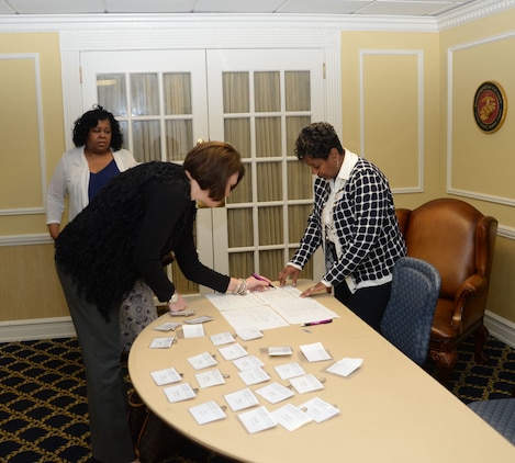 Veronica Curtis Richie (right), professional development trainer, Military Child Education Coalition, Harker Heights, Tex., assists area educators, counselors, agency directors and other supporters to register for a full day of training at Marine Corps Logistics Base Albany’s Conference Center, Oct 5. The training was scheduled to teach techniques to assist transitioning military children to reach their full potential.