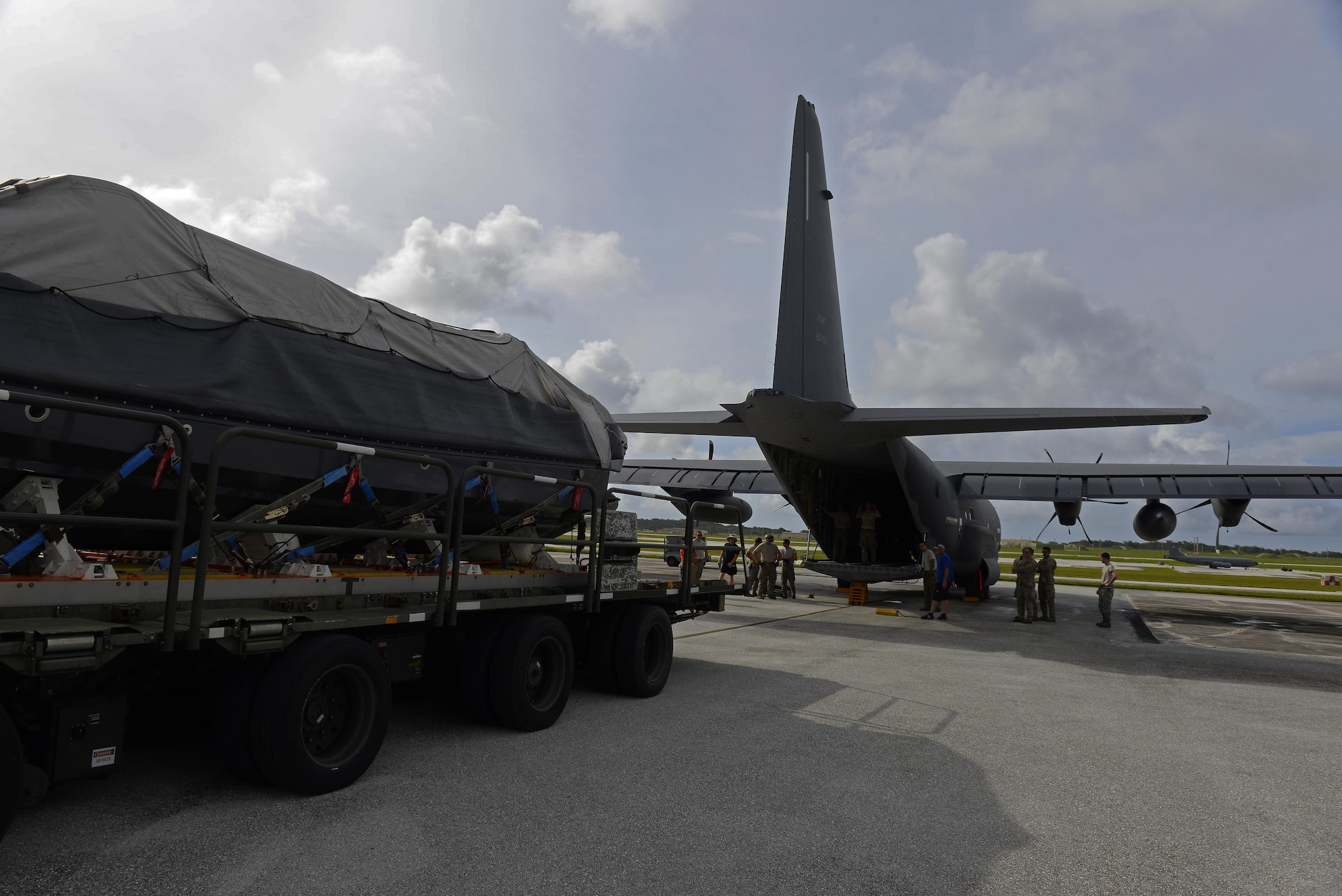 A U.S. Air Force MC-130J and MC-130H crew drop a watercraft and supplies during an exercise Sept. 19, 2015, over the Pacific Ocean.  This was the first time an MC-130J Commando II completed the Maritime Craft Aerial Delivery System airdrop in the Pacific. (U.S. Air Force photo by Airman 1st Class Alexa Ann Henderson)