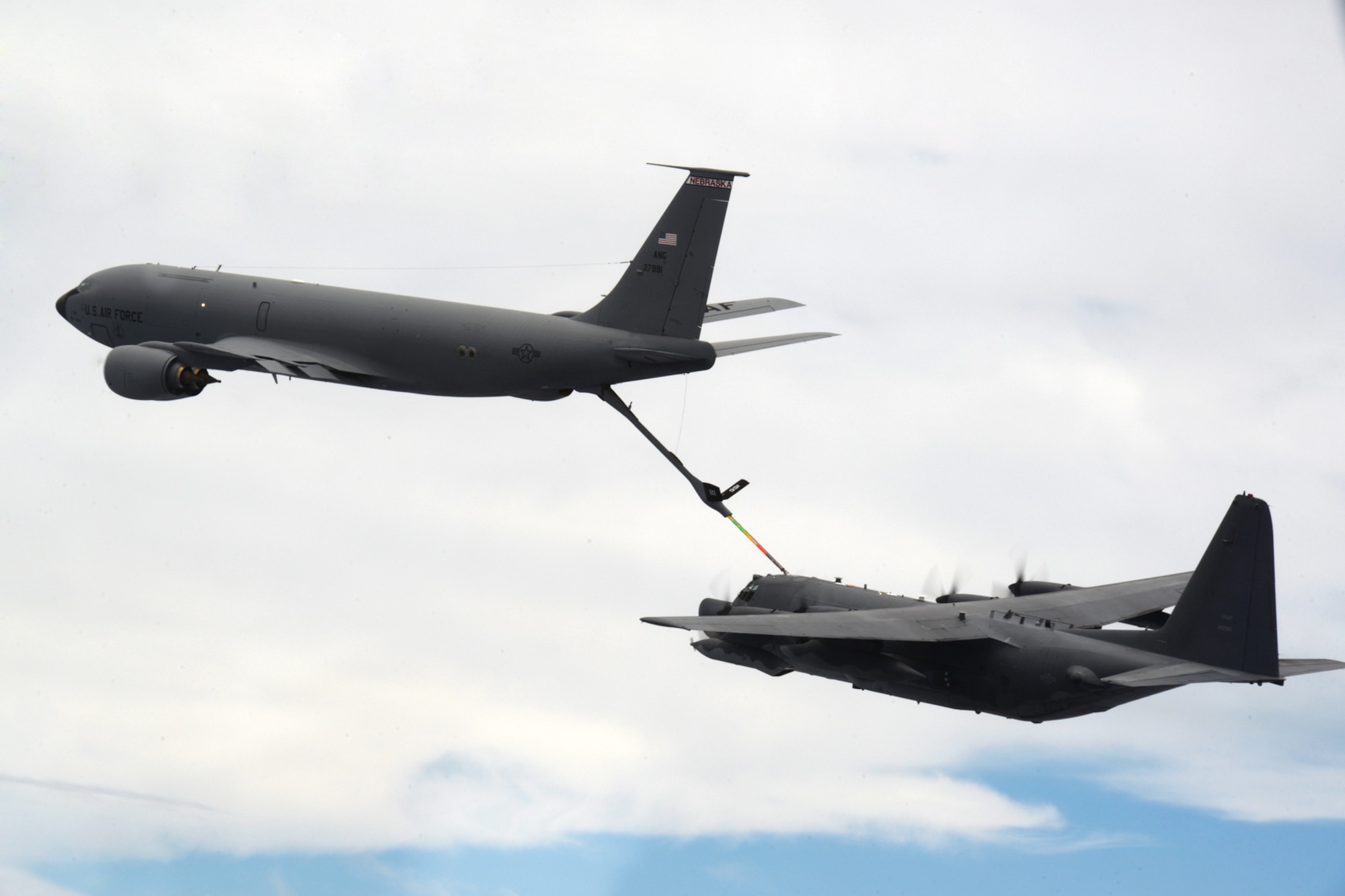 A KC-135 Stratotanker crew refuels an MC-130H Combat Talon II during an exercise Sept. 19, 2015, over the Pacific Ocean. The MC-130H was part of a dissimilar formation with an MC-130J that completed a Maritime Craft Aerial Delivery System airdrop.  This was the first time an MC-130J Commando II completed the MCADS airdrop in the Pacific.  (U.S. Air Force photo by Airman 1st Class Alexa Ann Henderson)