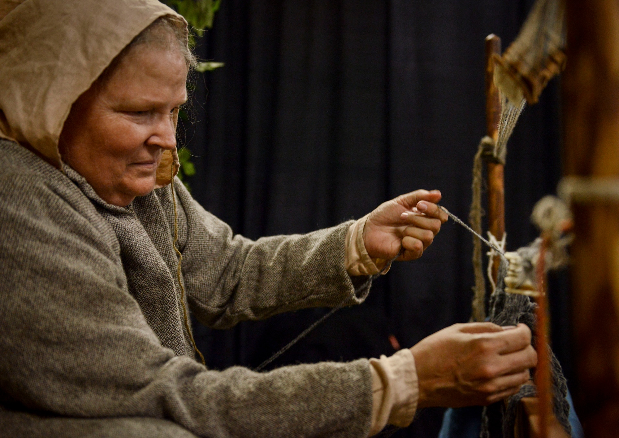 Julie Watkins, artisan, uses a technique called card weaving to create the top of a broadcloth during Norsk Høstfest  Military Appreciation Day in Minot N.D., Oct. 3, 2015. According to their website, Norsk Høstfest is the largest Scandinavian festival in North America. The event celebrates cultures from Norway, Denmark, Sweden, Finland and Iceland. (U.S. Air Force photo/Senior Airman Stephanie Morris)