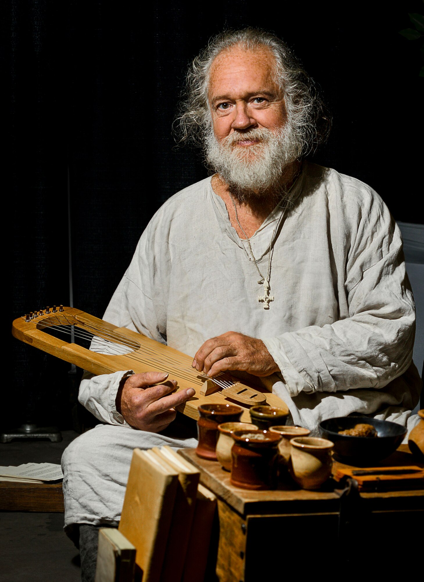 T.L. Watkins, artisan, sits at his work station during Norsk Høstfest Military Appreciation Day in Minot N.D., Oct. 3, 2015. Watkins and his fellow artisans were one of many areas and displays Air Force members and their families were able to view. (U.S. Air Force photo/Senior Airman Stephanie Morris)