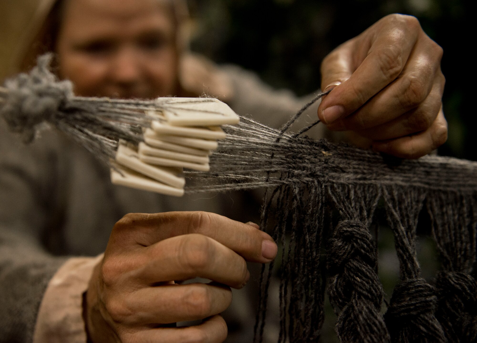 Julie Watkins, artisan, uses a technique called card weaving to create the top of a broadcloth during Norsk Høstfest  Military Appreciation Day in Minot N.D., Oct. 3, 2015. According to their website, Norsk Høstfest is the largest Scandinavian festival in North America. The event celebrates cultures from Norway, Denmark, Sweden, Finland and Iceland. (U.S. Air Force photo/Senior Airman Stephanie Morris)