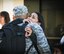 An airman with the Hawaii Air National Guard's 154th Aircraft Maintenance Squadron hugs a loved one before leaving for a deployment, Sept. 26, 2015, at Joint Base Pearl Harbor-Hickam. Airmen from the 154th Wing, Hawaii Air National Guard and active duty 15th Wing are part of the Hawaiian Raptor deployment to the Central Command Area of Responsibility. (U.S. Air National Guard photo by Airman 1st Class Robert Cabuco/released)
