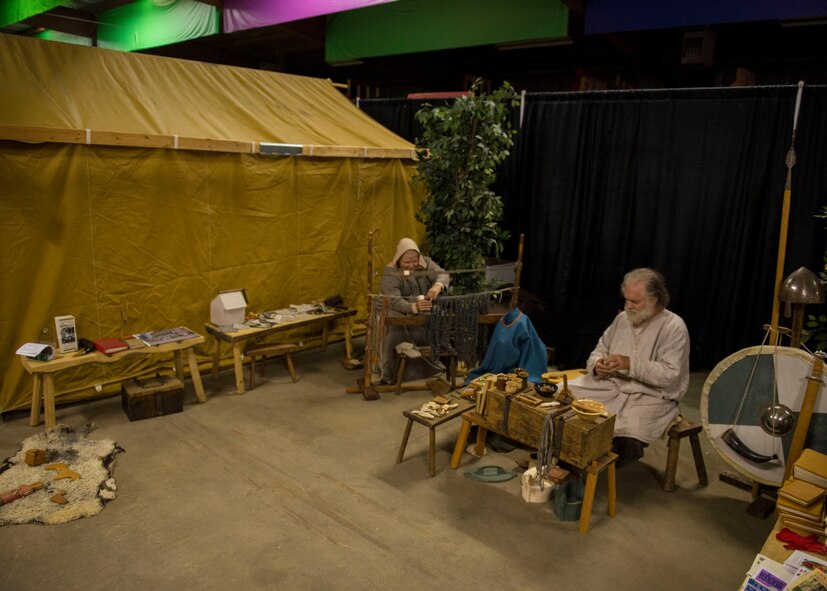 T.L. Watkins, artisan and his wife Julie, sew bindings for books and weave broadcloth during Norsk Høstfest Military Appreciation Day in Minot N.D., Oct. 3, 2015. Norsk Høstfest is the largest Scandinavian festival in North America. The event celebrates cultures from Norway, Denmark, Sweden, Finland and Iceland. (U.S. Air Force photo/Senior Airman Stephanie Morris)