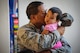 An Airman with the Hawaii Air National Guard's 154th Aircraft Maintenance Squadron kisses his daughter before leaving for a deployment, Sept. 26, 2015, Joint Base Pearl Harbor-Hickam. Airmen from the 154th Wing, Hawaii Air National Guard and active duty 15th Wing are part of the Hawaiian Raptor deployment to the Central Command Area of Responsibility. (U.S. Air National Guard photo by Airman 1st Class Robert Cabuco/released)