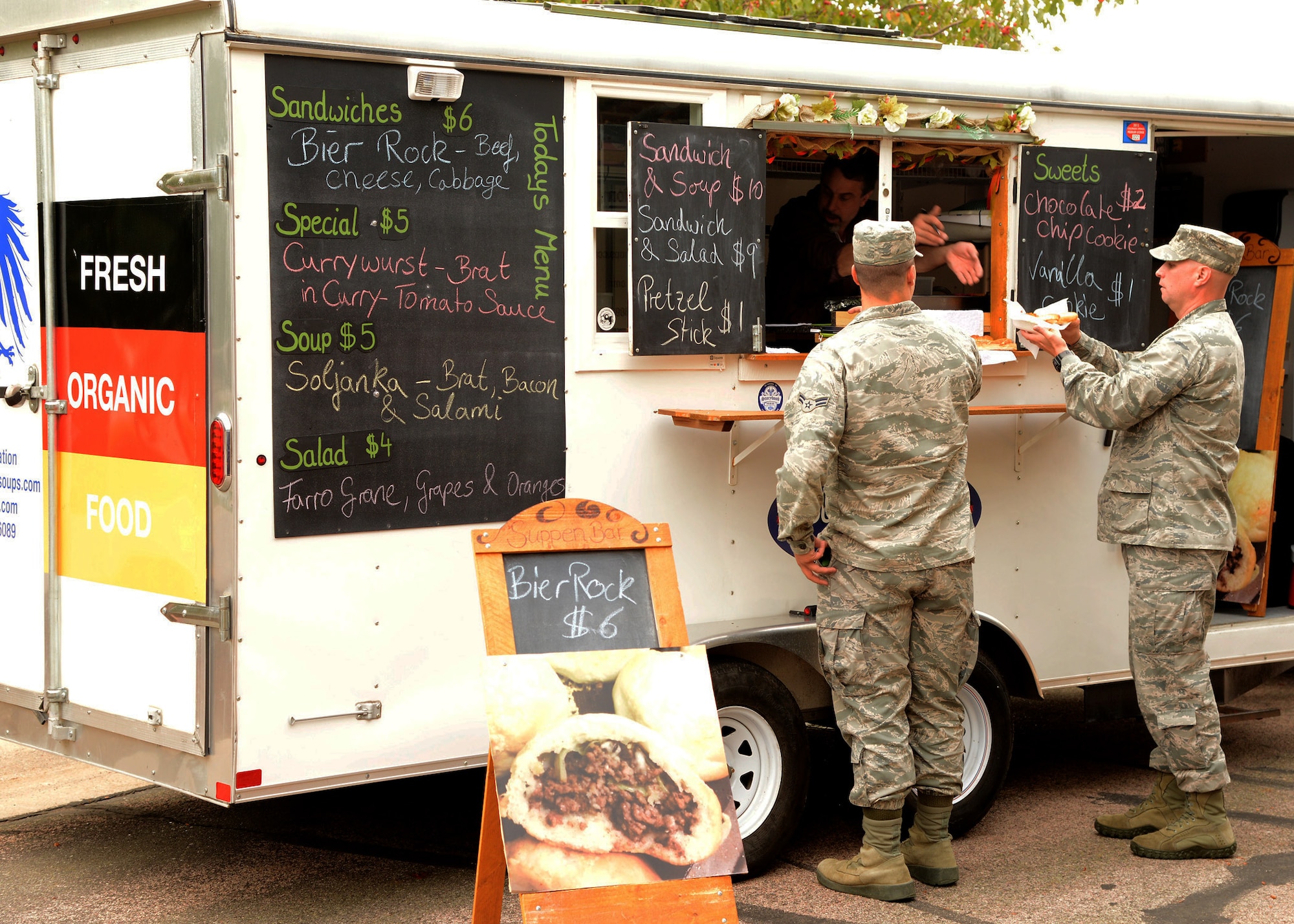 PETERSON AIR FORCE BASE, Colo. – Team Pete personnel enjoy food, fun, and live music during the “Trucktoberfest” celebration at the Club Oct. 2, 2015. This unique twist on the German Oktoberfest celebration, hosted by the 21st Force Support Squadron, gave members and their families an opportunity to enjoy local food trucks, listen to a live band, and even dress up in lederhosen. For additional details on upcoming 21st FSS sponsored events, check out www.21fss.com for more information. (U.S. Air Force photo by Capt. William Russell)