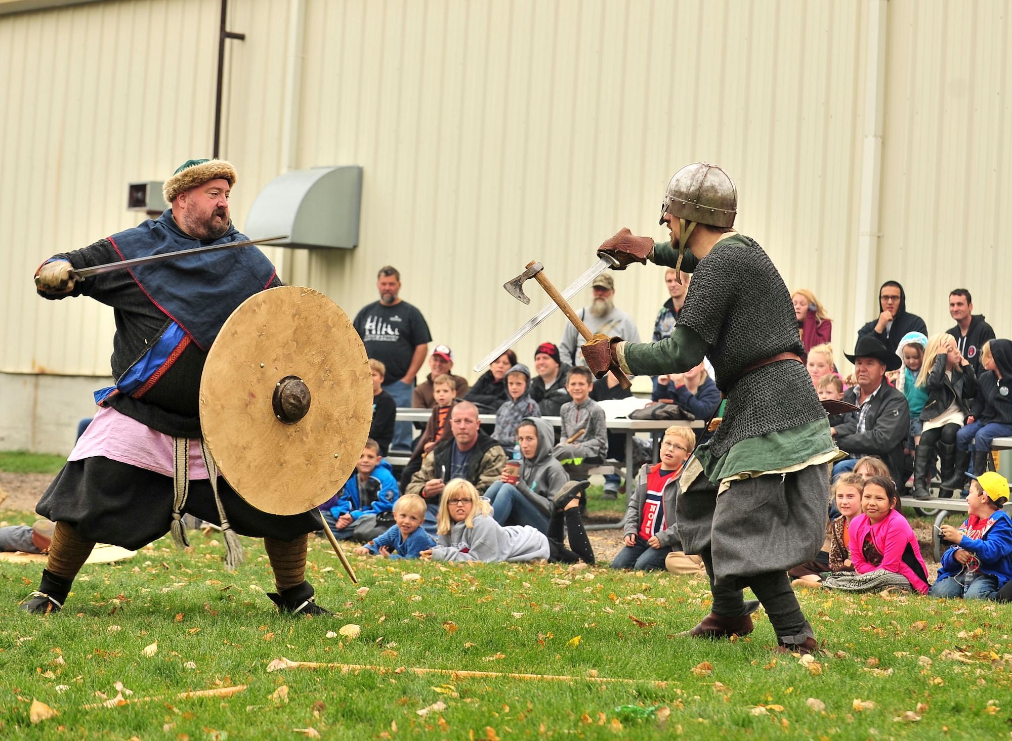 Sam Overland, Viking reenactor (left), does a simulated battle with another actor during Norsk Høstfest Military Appreciation Day in Minot N.D., Oct. 3, 2015. Overland and his fellow Vikings educated the crowd on Nordic battle customs and weaponry. (U.S. Air Force photo/Senior Airman Stephanie Morris)