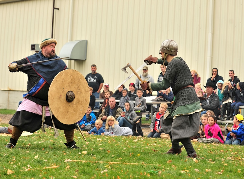 Sam Overland, Viking reenactor (left), does a simulated battle with another actor during Norsk Høstfest Military Appreciation Day in Minot N.D., Oct. 3, 2015. Overland and his fellow Vikings educated the crowd on Nordic battle customs and weaponry. (U.S. Air Force photo/Senior Airman Stephanie Morris)
