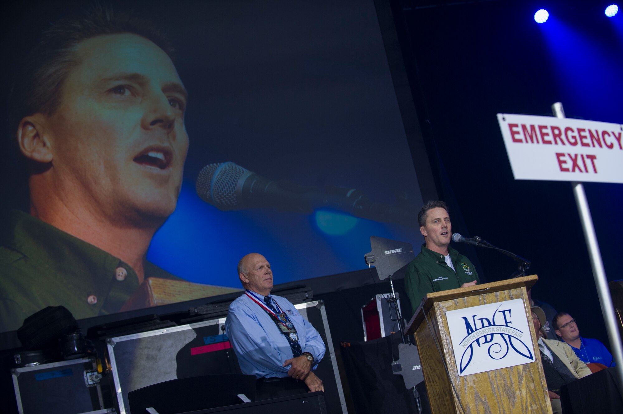 Col. Jason Armagost, 5th Bomb Wing commander, speaks at the annual Norsk Høstfest in Minot, N.D., Oct. 3, 2015. This was the 38th annual Norsk Høstfest, celebrating the Scandinavian heritage found in North Dakota. The festival also hosted a military appreciation day which gave free admission to military members and their families, along with discounted prices on concert tickets. (U.S. Air Force photo/ Senior Airman Apryl Hall)