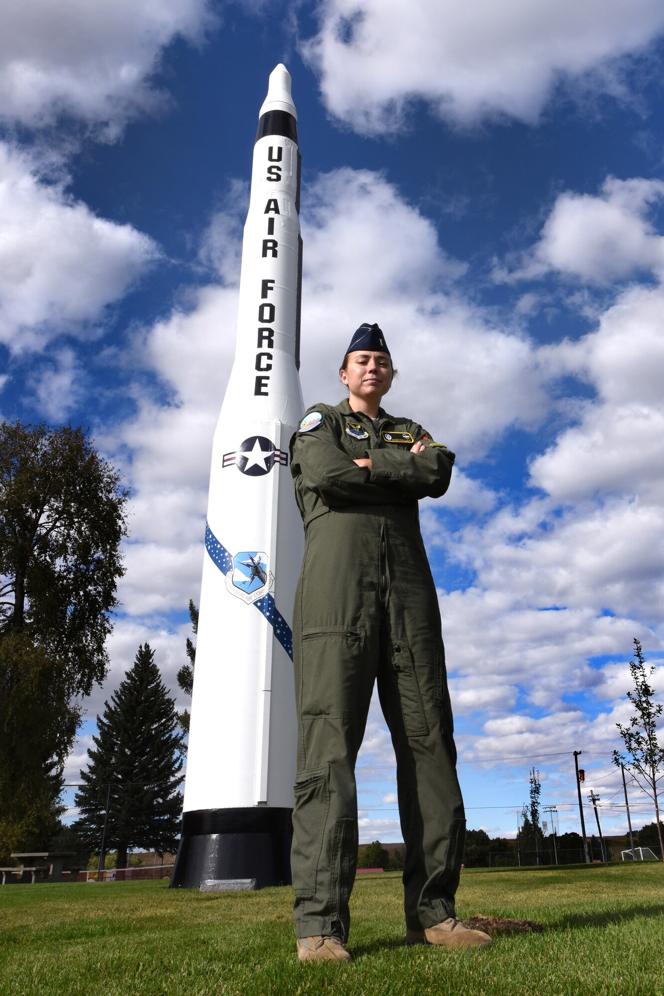 2nd Lt. Angie Phillips, 490th Missile Squadron deputy missile combat crew commander, stands in front a Minuteman I missile Sept. 18, 2015, in Lewistown, Mont.  Phillips and a handful of volunteers from Malmstrom Air Force Base, Mont., and the community restored the Minuteman I missile back to its old glory. (U.S. Air Force photo/Chris Willis)