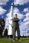 2nd Lt. Angie Phillips, 490th Missile Squadron deputy missile combat crew commander, stands in front a Minuteman I missile Sept. 18, 2015, in Lewistown, Mont.  Phillips and a handful of volunteers from Malmstrom Air Force Base, Mont., and the community restored the Minuteman I missile back to its old glory. (U.S. Air Force photo/Chris Willis)
