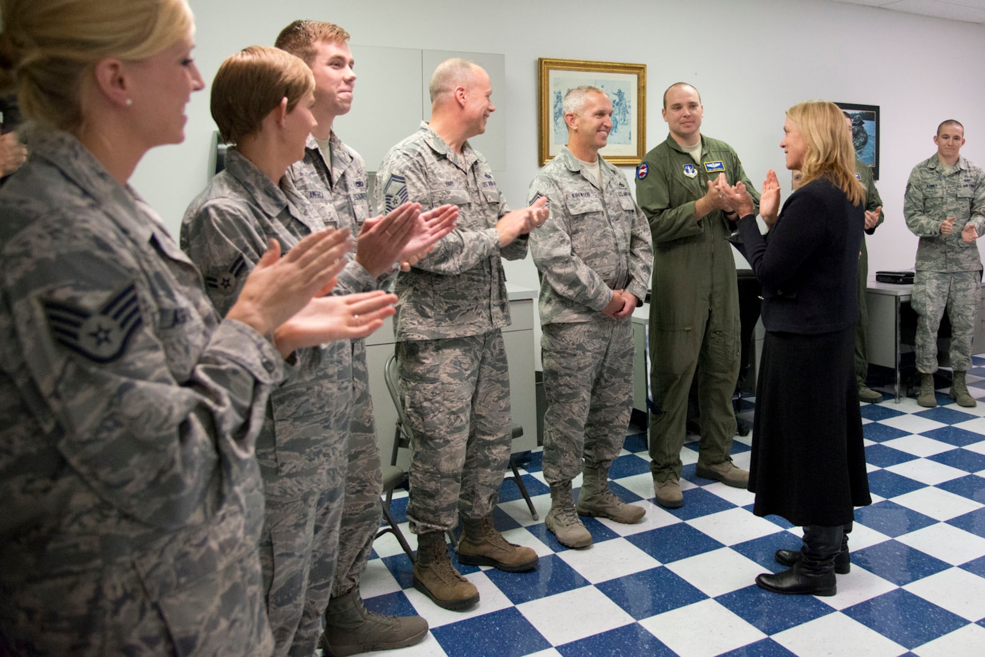 MARTINSBURG, W.Va.-- Secretary of the Air Force Deborah Lee James and Airmen from the 167th Airlift Wing, Martinsburg, W.Va, applaud Senior Master Sgt. Todd Kirkwood, 167th Outstanding Honor Guard Airman of the Year 2015, for celebrating his 30th anniversary of serving in the military. (U.S. Air National Guard photo by Staff Sgt. Jodie Witmer /Released)