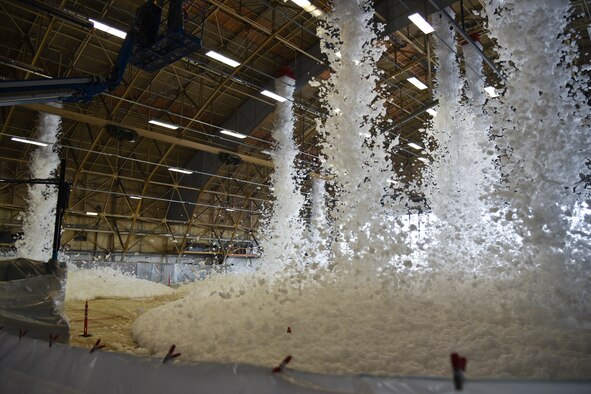 The 92nd Civil Engineer Squadron conducts a foam suppression system test in hangar one Oct. 1, 2015, at Fairchild Air Force Base, Wash. The foam is known as Ansul High Expansion Concentrate, when mixed with water the solution becomes 2 percent foam and 98 percent water. The system has a capacity to fill one entire hangar with approximately 20 feet of foam. (U.S. Air Force photo/Airman 1st Class Mackenzie Richardson)