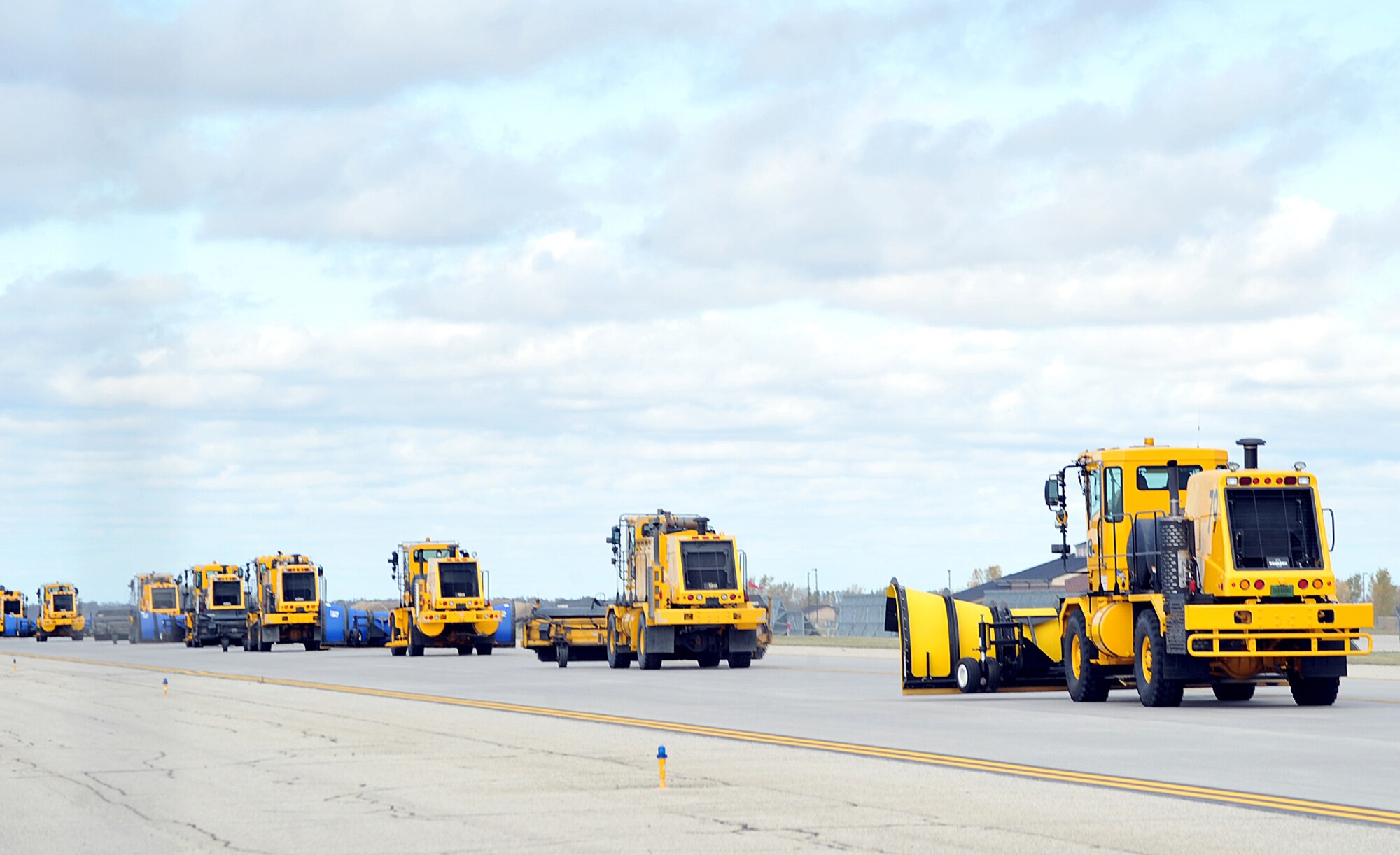 Snow removal equipment being operated by commanders from the base journey along the flight line during the annual Snow Parade Oct. 5, 2015, on Grand Forks Air Force Base, North Dakota. There were 12 pieces of snow removal equipment in the parade this year. (U.S. Air Force photo by Airman 1st Class Bonnie Grantham/released)