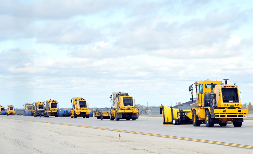 Snow removal equipment being operated by commanders from the base journey along the flight line during the annual Snow Parade Oct. 5, 2015, on Grand Forks Air Force Base, North Dakota. There were 12 pieces of snow removal equipment in the parade this year. (U.S. Air Force photo by Airman 1st Class Bonnie Grantham/released)