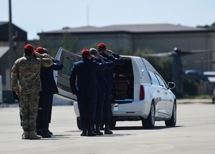 Special Tactics Airmen salute the remains of Staff Sgt. Forrest B. Sibley during a dignified arrival at Hurlburt Field, Fla., Sept. 14, 2015. The two Special Tactics Airmen, who had recently deployed to Afghanistan in support of Operation Freedom's Sentinel, were shot at a vehicle checkpoint at Camp Antonik, Afghanistan, Aug. 26, and died of wounds sustained in the attack. (U.S. Air Force photo/Airman Kai White)