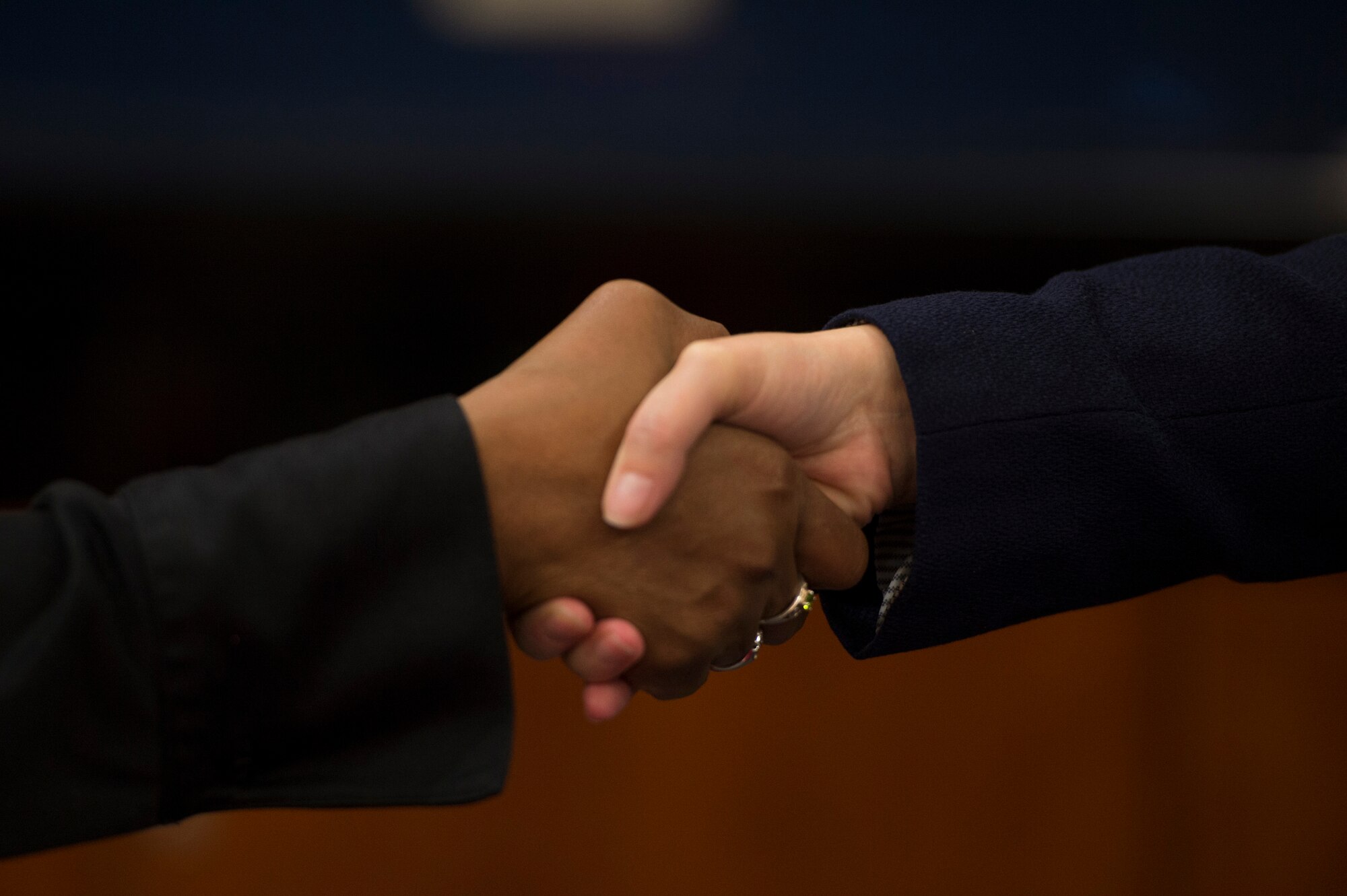 Spangdahlem community members greet each other before discussing job opportunities during a job fair at Club Eifel on Spangdahlem Air Base, Germany, Oct. 6, 2015. Job seekers were encouraged to dress appropriately and bring their resumes to hand out to the hiring agencies. (U.S. Air Force photo by Staff Sgt. Christopher Ruano/Released)