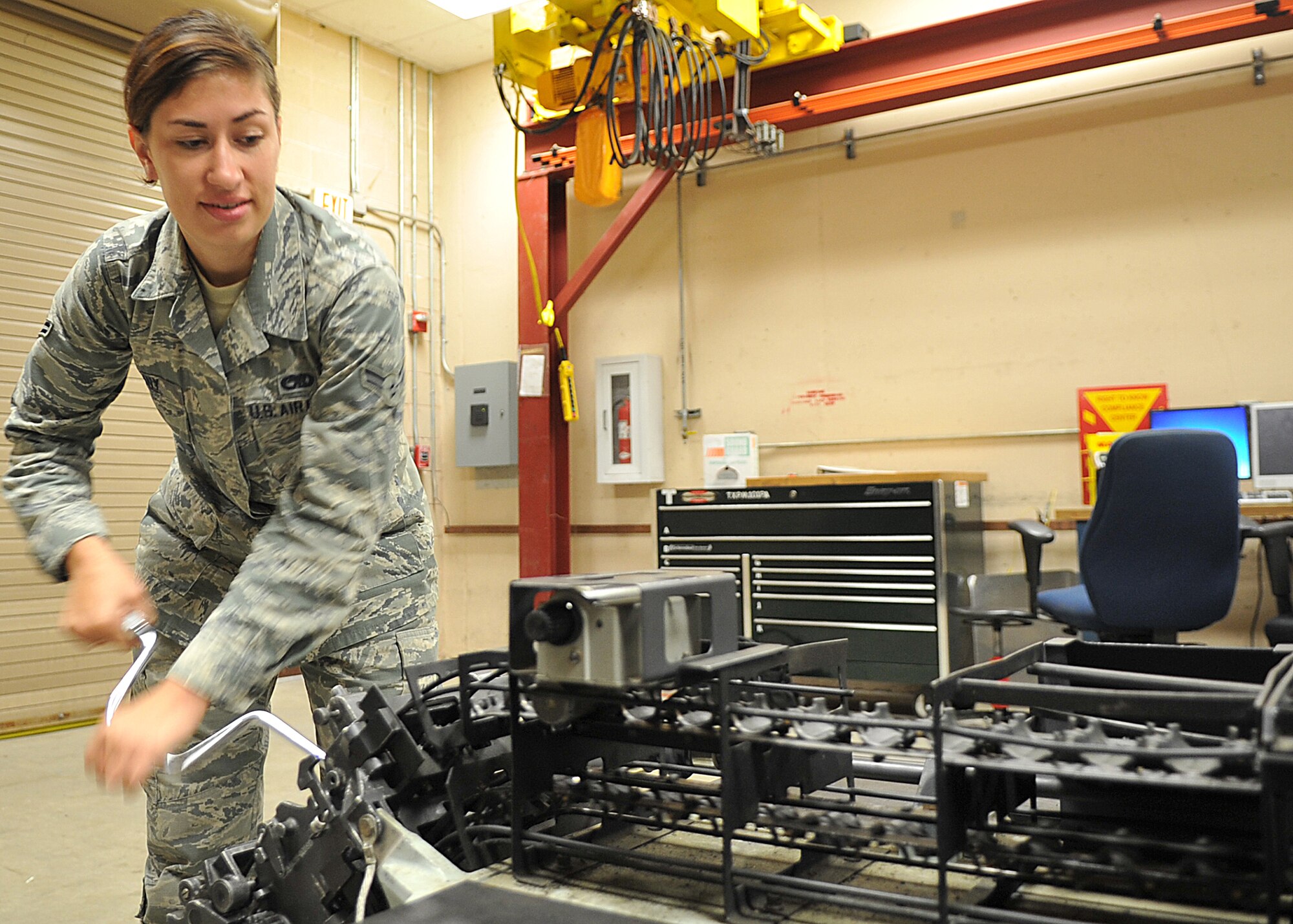 Airman 1st Class Shiloh Cuny, 325th Maintenance Squadron conventional maintenance crew member, operates a 20mm replenisher table Oct. 1 at an ammo facility. The 20mm replenisher table is used to count and inspect the brass of 20mm ammunition. (U.S. Air Force photo by Senior Airman Ty-Rico Lea/Released)