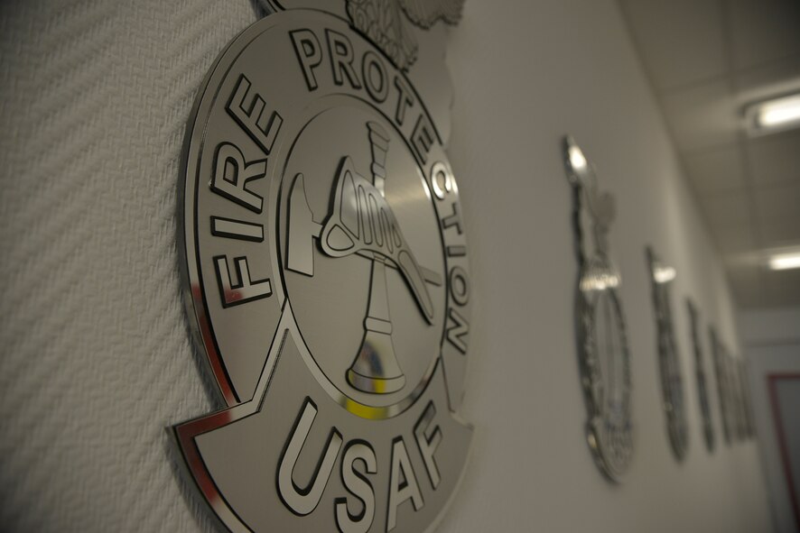 Fire Protection insignias decorate the long hallway inside the newly-renovated Fire Station 2, which officially reopened Sept. 22, 2015, at Ramstein Air Base, Germany. Station 2 is the only fire station north of the flight line, enabling quick response times to areas such as base housing, the Kaiserslautern Military Community Center and high-risk work facilities. (U.S. Air Force photo/Airman 1st Class Lane T. Plummer)