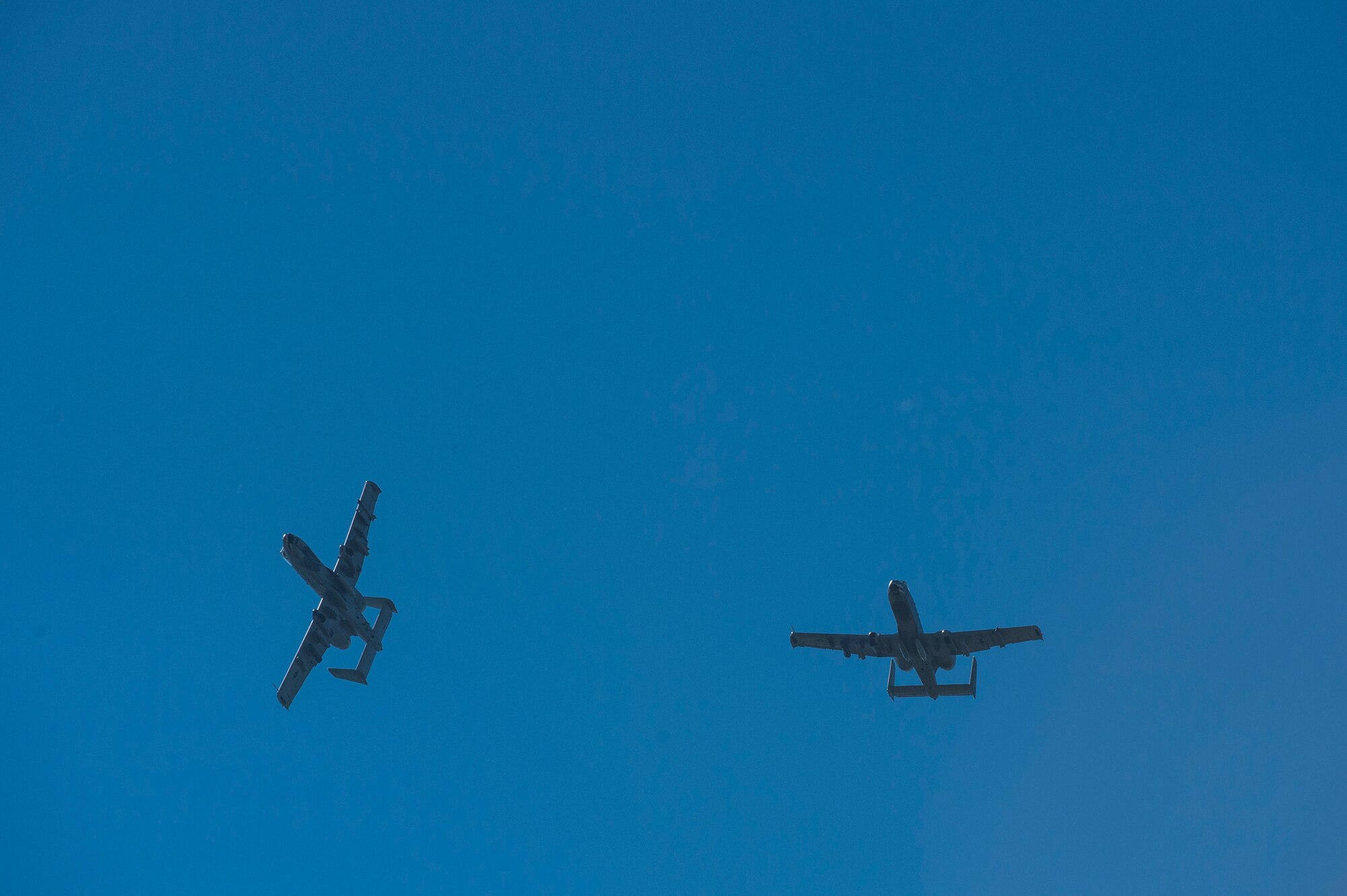 U.S. Air Force A-10 Thunderbolt II attack aircraft assigned to the 74th Expeditionary Fighter Squadron, soar through the sky over Spangdahlem Air Base, Germany, Oct. 2, 2015. Approximately 350 Airmen and support equipment from the 23rd Wing at Moody Air Force Base, Ga., will conduct routine flying training and participate in several exercises and training events with NATO allies to strengthen interoperability and demonstrate U.S. commitment to the security and stability of Europe. (U.S. Air Force photo by Staff Sgt. Christopher Ruano/Released)