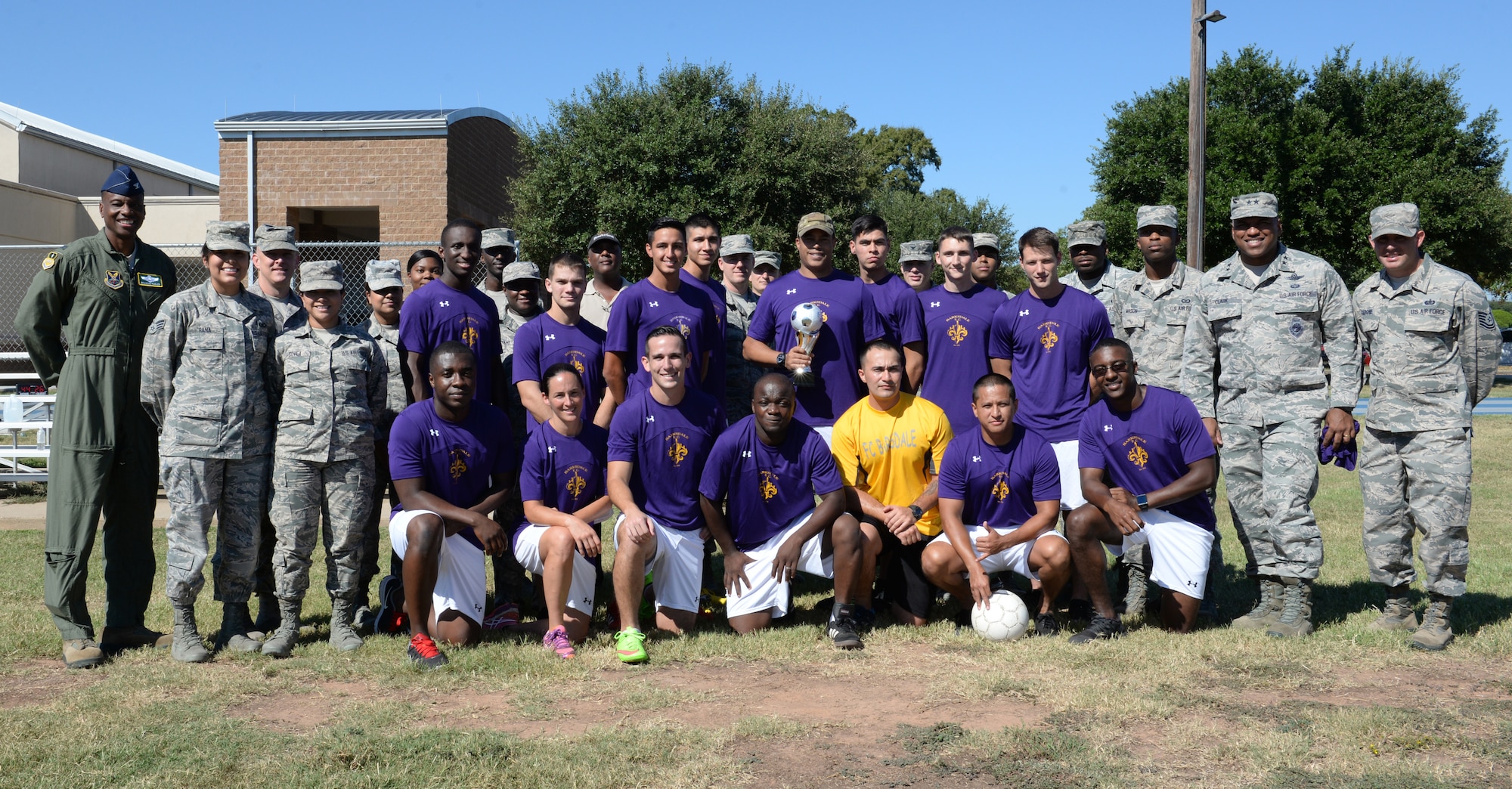Members of the Barksdale Football Club, leadership and supporters pose for a photo at Barksdale Air Force Base, La., Sept. 23, 2015. The team recently competed in the Defenders Cup in San Antonio, Texas, and exceeded their expectations by finishing fourth out of 40 teams and went further into the tournament than any other all-Air Force team. The Defenders Cup is essentially the World Cup for the United States Armed Forces, where each year military installations from across the nation send teams to compete and represent their branches of service. (U.S. Air Force photo/Airman 1st Class Curt Beach)
