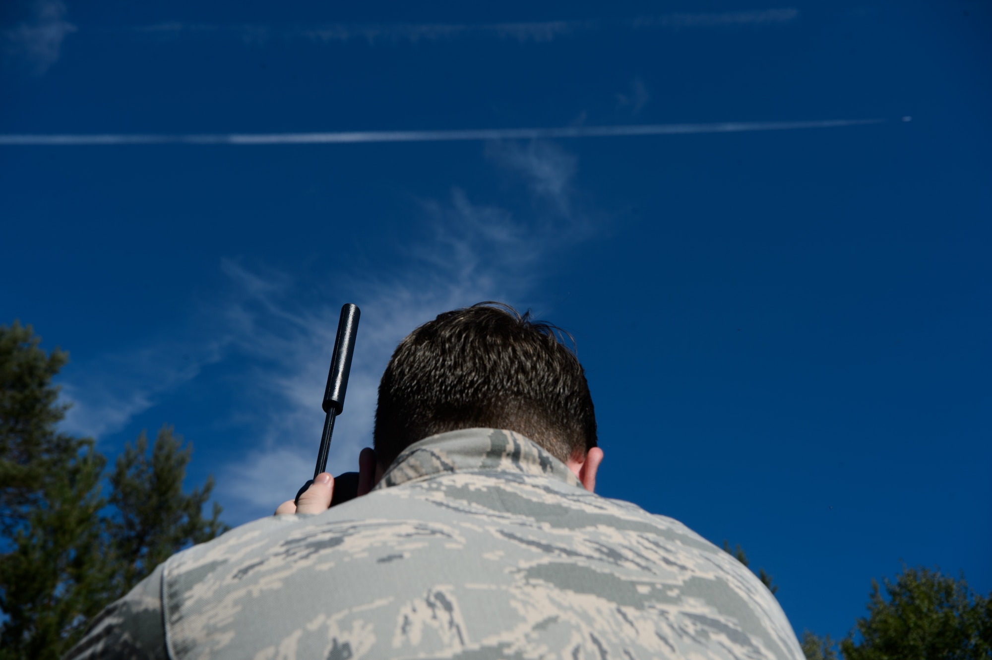 Senior Airman Zan Walker, 7th Weather Squadron battlefield weather forecaster, calls his fellow Airmen to relay information gathered in the field during a training event Sept. 17, 2015, at Grafenwohr Training Area, Germany. The instructors of the 7th WS used a variety of tools including briefing and hands-on lessons to develop 30 battlefield weather airmen during the annual Cadre Focus training exercise. The 7th WS revamped Cadre Focus to concentrate on basic field training skills and forecasting in Eastern Europe. The squadron is the only one embedded alongside Army units providing weather intelligence throughout the European and African areas of operation. (U.S. Air Force photo/Staff Sgt. Armando A. Schwier-Morales)